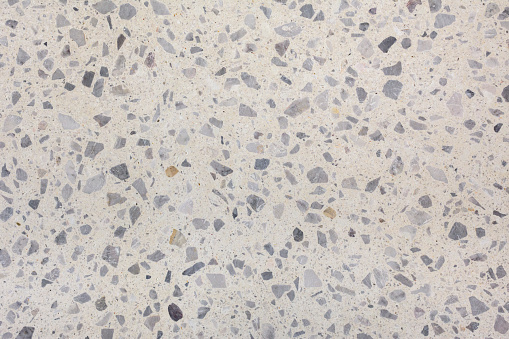 Beige terrazzo floor with gray stone applications