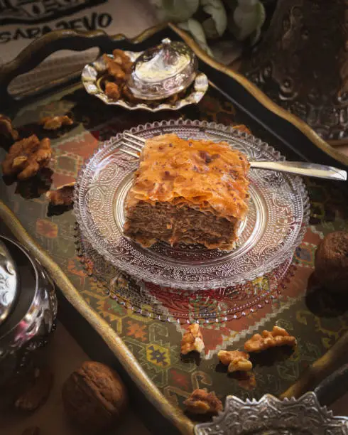 Traditional Baklava from Bosnia is a rich, sweet dessert  made from layers of yufka, filled with sliced nuts and sweetened and held together with Sita syrup.