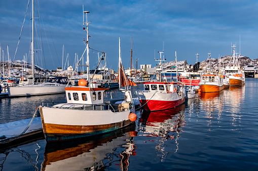 Fishing boats in the harbour of Bodo, Norway in winter.