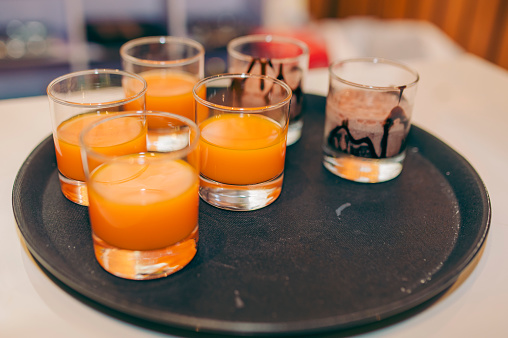 Orange juice glasses in a plate stock photo