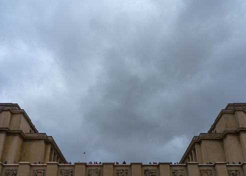 Tourists on Trocadero square and viewing platform, cloudy sky background. Paris, France. March 25, 2023.