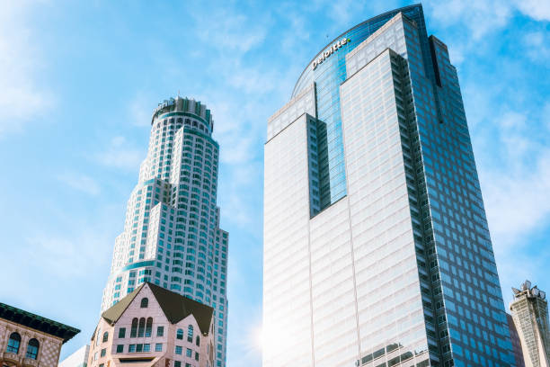 u.s. bank tower, and the deloitte building or gas company tower, looking up from pershing square, downtown los angeles, california - u s bank tower imagens e fotografias de stock