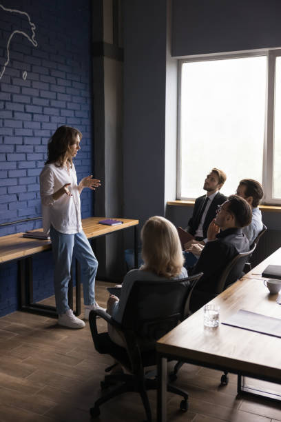 istock Creative business group discussing ideas for startup, brainstorming on briefing. 1486590138
