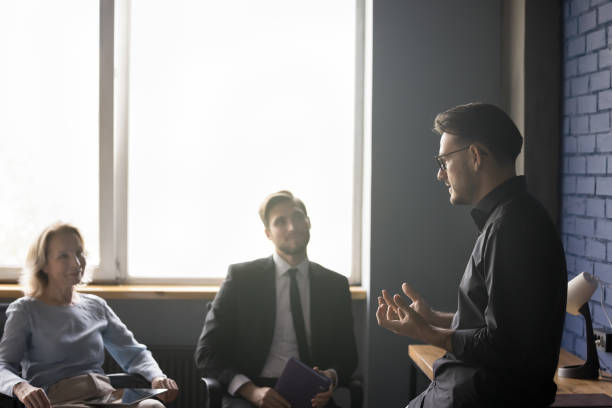 istock Smart confident boss discussing business ideas, strategy, plan 1486590959