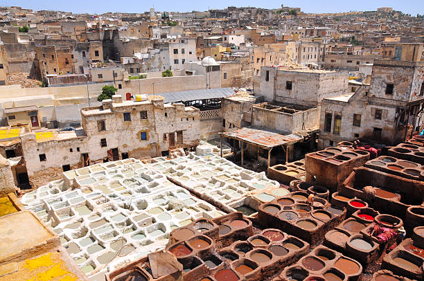 Leather tannery in Fez, Morocco Very old technology leather tannery downtown Fez in Morocco meknes stock pictures, royalty-free photos & images