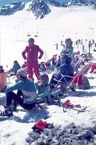 Austria (exact location unknown), 1978. Winter vacationers at the edge of a ski slope in the European Alps.