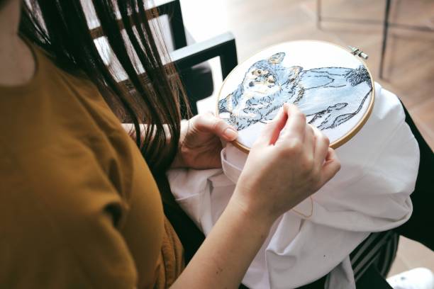 istock Brunett woman doing embroidery work. 1486599614