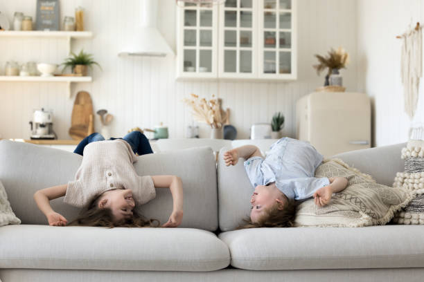 istock Two cute energetic sibling kids having fun at home 1486601373