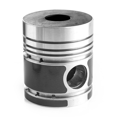 New Piston from a car engine isolated on white background