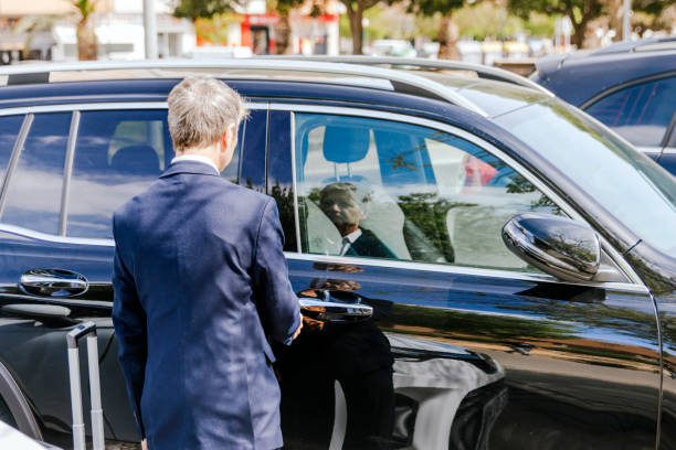 istock Businessman getting into his luxurious car 1486611496