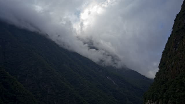 Timelapse of clouds forming above a mountain in Peru