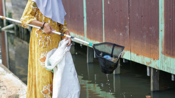 istock women clean up trash around the house with trash nets 1486618653