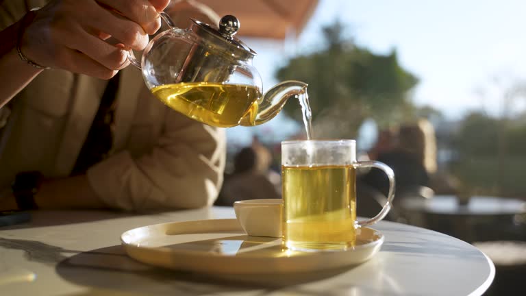 Filling the cup with herbal tea