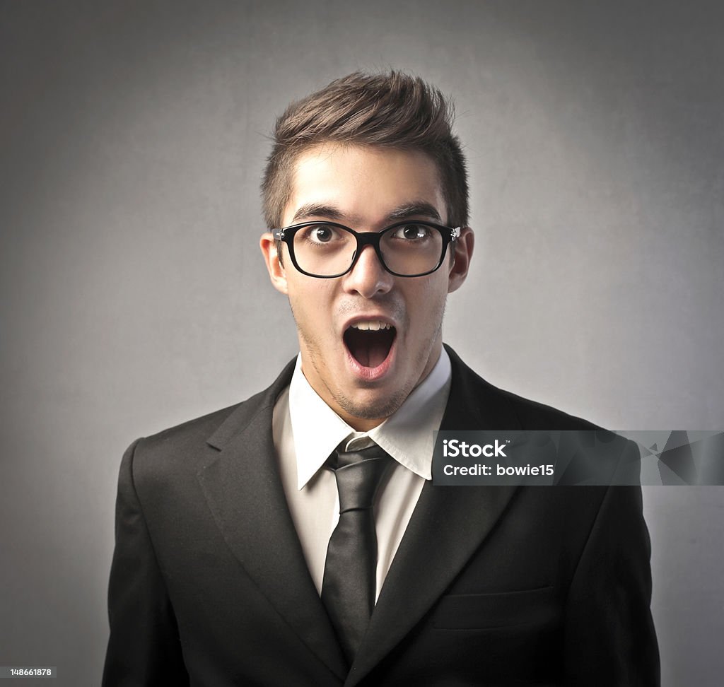 Amazing news Young businessman with astonished expression Adult Stock Photo