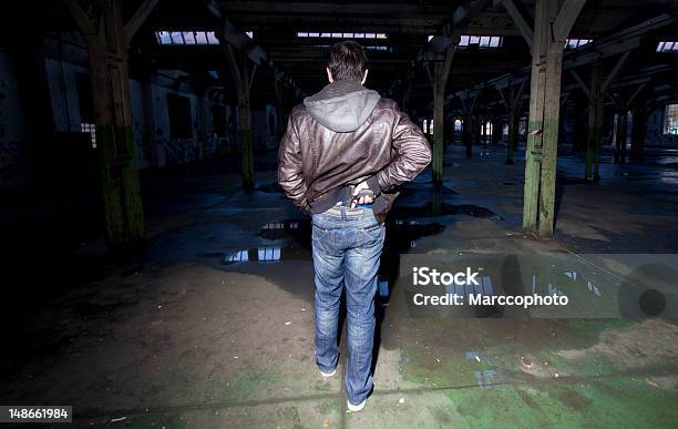 Man Pulling Gun From Secret Place On His Waist Stock Photo - Download Image Now - Gun, Waist, Criminal