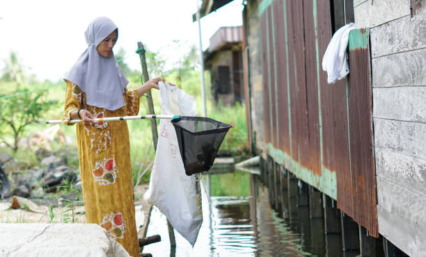 istock women clean up trash around the house with trash nets 1486620149