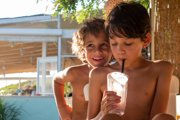 istock Brothers for milkshake cocktail on the beach 1486621534