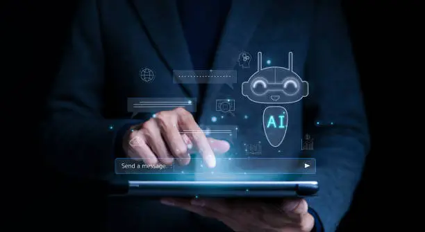 Photo of Businessman use AI to help work, AI Learning and Artificial Intelligence. Business, modern technology, internet and networking concept. AI technology in everyday life. A.I., Chat AI, Generative Ai,