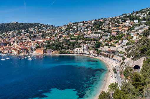 This photo captures the essence of the French Riviera, with its azure blue waters and pristine beaches. The crystal-clear waters gently caress the sandy shoreline, inviting visitors to dip their toes in the refreshing Mediterranean Sea. Whether you're a lover of sun, sea, and sand, or simply appreciate the breathtaking beauty of nature, this image is sure to transport you to a place of relaxation and tranquility.