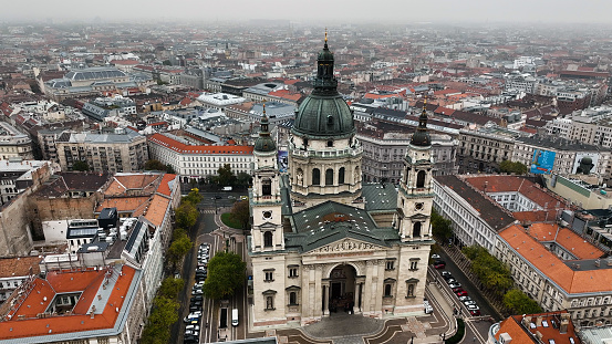 Breathtaking Aerial View of Budapest's City Skyline with St. Stephen's Basilica on a Cloudy Day in Hungary.