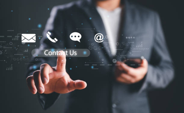 istock Contact us, Customer service and support hotline people connect. Businessman using smartphone and touching on virtual screen contact icons email, phone, chat, address, call center service, help desk. 1486642533