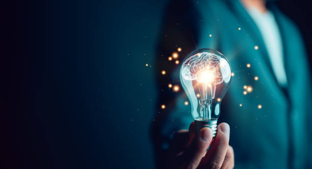 istock New idea innovation concept, man holding Light bulbs with Brain inside. Creative and innovation inspiration. Business Bright idea concept. 1486643176