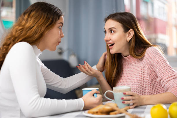 istock Two young women talking resting at home 1486643541