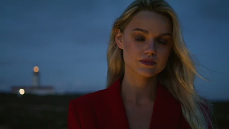 Serious lady looking camera night sky nature. Nature beauty woman lighthouse