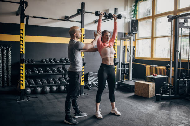istock Woman training with dumbbells 1486644388
