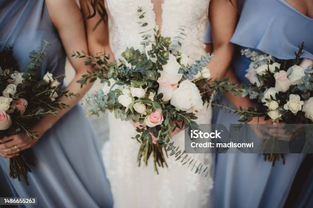 Bride And Bridesmaids Holding Bouquets Of Flowers Stock Photo - Download Image Now - Wedding, Bridesmaid, Flower