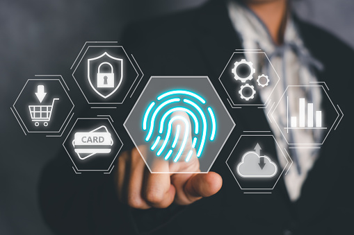 Business person hand using fingerprint indentification to access personal financial data, Fingerprint scan provides security access with biometrics identification.