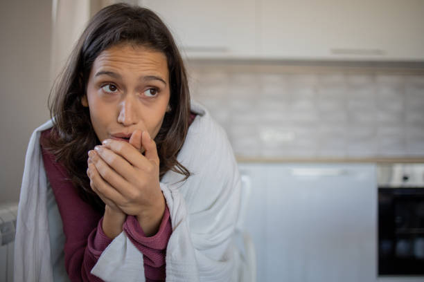 istock Woman feel cold in home with no heating 1486661968