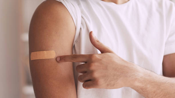 istock Flu vaccination inoculation shot bandage shoulder 1486662226
