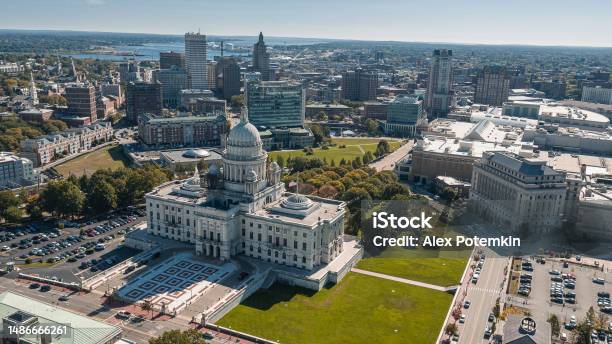 Rhode Island State House In Providens On Capitol Hill Famous Landmark Of The City With A Remote View Of Downtown Providence And Providence River In The Backdrop Stock Photo - Download Image Now