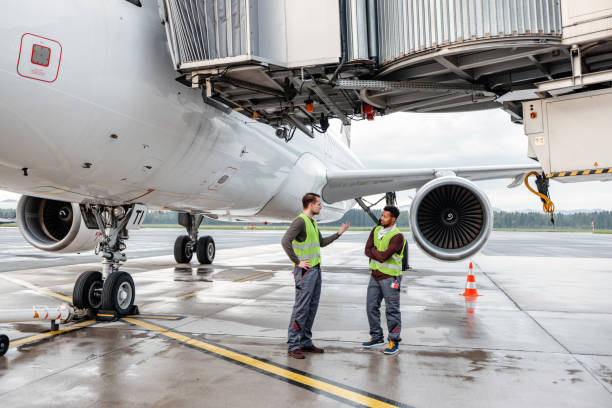 istock Airport Workers Handling Airplane 1486670426