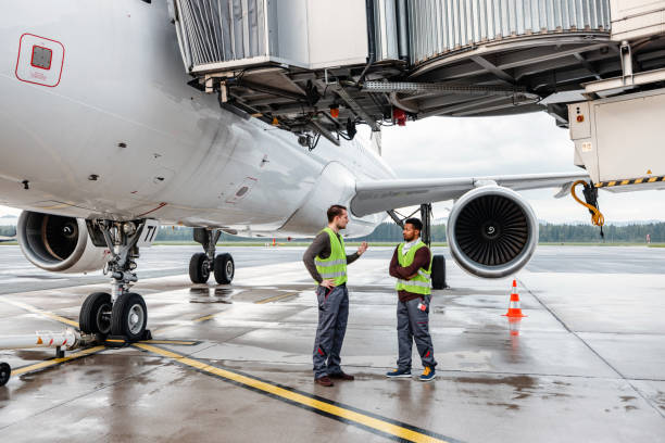 istock Airport Workers Handling Airplane 1486670456