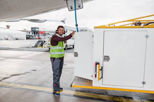 an aircraft mechanic inspecting the jet before flight - ground crew audio imagens e fotografias de stock