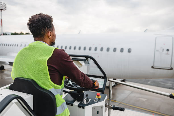 istock Airport Worker Handling An Airplane 1486670518