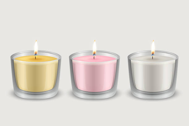 istock Vector 3d Realistic Yellow, Pink, White Paraffin or Wide Wax Burning Party, Spa Candle in Transparent Glass Cup, Bowl with Flame of a Candle Icon Set Isolated. Design Template, Front View 1486672648