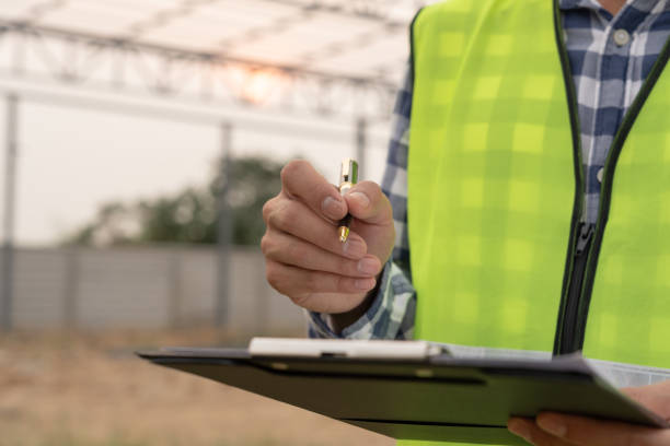 istock inspector or engineer is inspecting construction and quality assurance new factory using a checklist. Engineers or architects or contactor work to build the factory before handing it over to the homeowner 1486673510