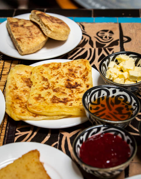 istock Traditional Moroccan breakfast with pancake, bread, butter, honey and jam 1486677271