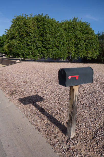 istock Black Metal Mail Box on a Wooden Post 1486680150