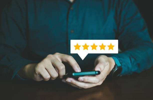 istock People select Five star for Feedback and Review Satisfaction on smartphone application, Service customer and testimonial. 1486686151