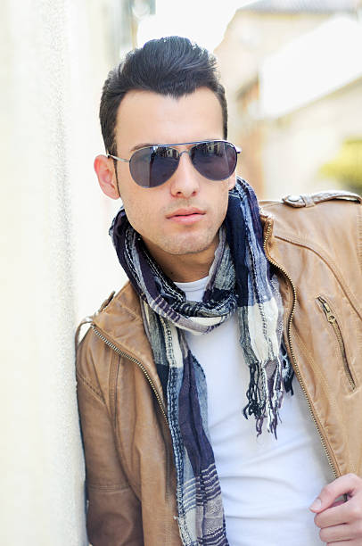 istock Attractive man with tinted sunglasses in urban background 148668646