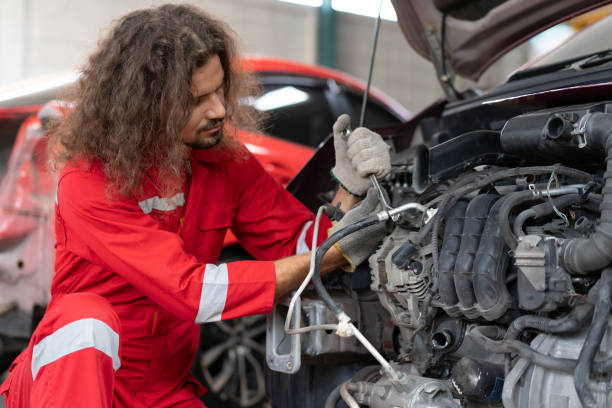 istock Auto mechanic working in vehicle repair service garage. 1486692574
