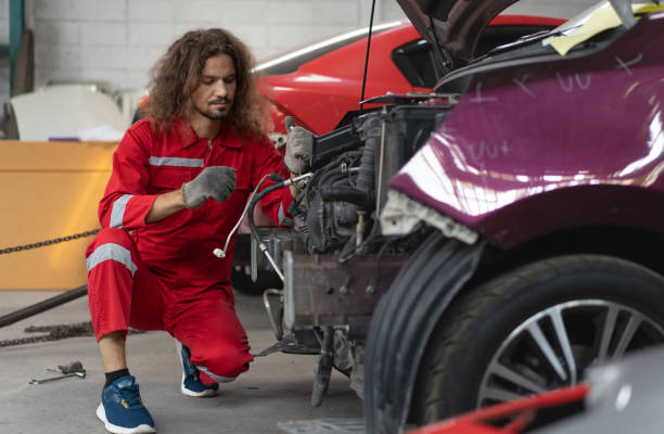 istock Auto mechanic working in vehicle repair service garage. 1486692578