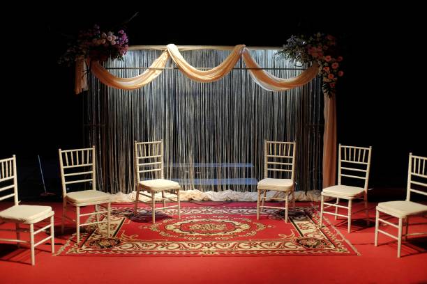 istock Stage performance with classic decor, curtains, red carpet and props seats 1486692996