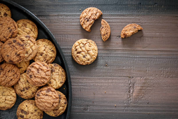 istock Chocolate cookies on a black pan. 1486693985