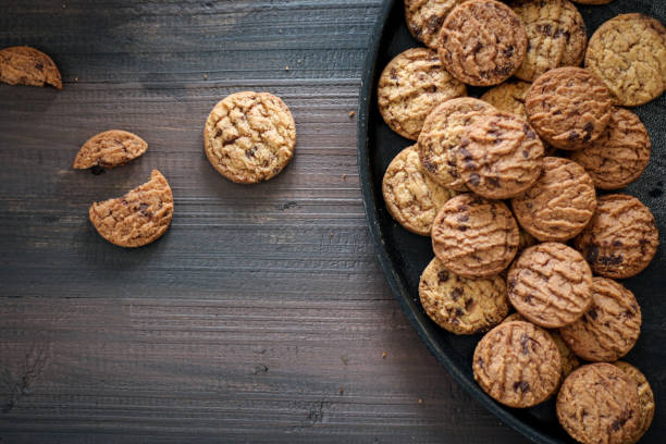 istock Chocolate cookies on a black pan. 1486694063