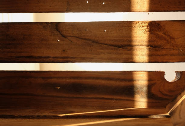 istock Wooden box. Burnt wood planks. Decor. Sunlight. Shadow. 1486706449